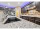 Bright kitchen with island seating, granite counters and stainless faucet at 18495 W Rimrock St, Surprise, AZ 85388