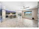 Spacious open kitchen with a large island, bar seating and backyard pool view at 18495 W Rimrock St, Surprise, AZ 85388