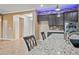 Island kitchen with seating, stainless appliances, and open floor plan at 18495 W Rimrock St, Surprise, AZ 85388