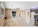 Inviting living room with a fireplace and plenty of room for seating, perfect for entertaining at 18495 W Rimrock St, Surprise, AZ 85388