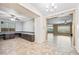 Open-concept living space with custom built-ins, lots of windows, and easy access to other rooms at 18495 W Rimrock St, Surprise, AZ 85388