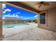 Outdoor covered patio with a view of the private pool and desert landscaping at 18495 W Rimrock St, Surprise, AZ 85388