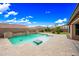 Desert backyard with a private pool, stone accents and desert landscaping at 18495 W Rimrock St, Surprise, AZ 85388