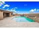 Gorgeous backyard pool and spa with travertine tile, perfect for outdoor relaxation and entertaining at 18495 W Rimrock St, Surprise, AZ 85388