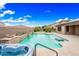 Backyard pool and spa area with desert landscaping and a privacy wall at 18495 W Rimrock St, Surprise, AZ 85388