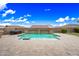 Backyard pool with beautiful desert landscaping, privacy walls, and a hot tub at 18495 W Rimrock St, Surprise, AZ 85388