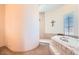 Luxurious bathroom featuring a soaking tub, separate walk-in shower, and neutral tile work at 19834 W Minnezona Ave, Litchfield Park, AZ 85340