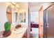 Bright bathroom with a decorative cactus pot, open to the main bedroom at 19834 W Minnezona Ave, Litchfield Park, AZ 85340