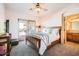 This is a lovely main bedroom with outdoor access, a connecting bathroom, and neutral tones at 19834 W Minnezona Ave, Litchfield Park, AZ 85340
