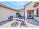 Cozy outdoor seating area on a paved patio, sheltered beneath the roof's eaves at 20215 N Mariposa Way, Surprise, AZ 85374