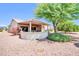 Backyard featuring a covered patio and low-maintenance landscaping, perfect for outdoor enjoyment at 20215 N Mariposa Way, Surprise, AZ 85374