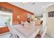 Dining room with tile floors, bright light, and access to the kitchen at 20215 N Mariposa Way, Surprise, AZ 85374