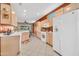 Spacious kitchen with tile flooring and modern white appliances at 20215 N Mariposa Way, Surprise, AZ 85374