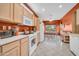 Updated eat-in kitchen with white appliances and tiled floors at 20215 N Mariposa Way, Surprise, AZ 85374