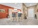 Bright, modern kitchen with a breakfast bar and tile flooring, blending functionality with style at 20215 N Mariposa Way, Surprise, AZ 85374