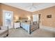 Warm main bedroom featuring neutral tones and private access to outdoor balcony at 20215 N Mariposa Way, Surprise, AZ 85374