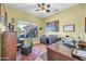 Home office with hardwood floors, natural light, and backyard views at 20215 N Mariposa Way, Surprise, AZ 85374
