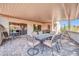 Inviting covered patio featuring a dining set and neutral tones, perfect for outdoor entertaining and relaxation at 20215 N Mariposa Way, Surprise, AZ 85374