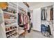 Organized walk-in closet features custom shelving and ample storage space for clothes and accessories at 20215 N Mariposa Way, Surprise, AZ 85374