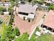 Aerial view of the backyard features mature trees, covered patio, pergola, and privacy at 20615 W Daniel Pl, Buckeye, AZ 85396
