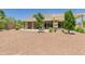 Spacious backyard features a large patio, mature trees, and privacy at 20615 W Daniel Pl, Buckeye, AZ 85396