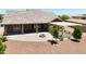 Spacious backyard featuring a pergola, outdoor fireplace, and covered patio with shade at 20615 W Daniel Pl, Buckeye, AZ 85396