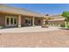 This home boasts a backyard with a large covered patio and a firepit at 20615 W Daniel Pl, Buckeye, AZ 85396