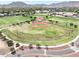 View of community baseball field and green grass at 20615 W Daniel Pl, Buckeye, AZ 85396