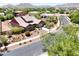 Beautiful single-story home featuring desert landscaping, and a three-car garage on a tree lined street at 20615 W Daniel Pl, Buckeye, AZ 85396