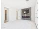 Large living room features a modern electric fireplace and plush carpet at 20615 W Daniel Pl, Buckeye, AZ 85396
