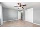 Bedroom featuring a ceiling fan, tile floor, and closet at 2064 W 2Nd St, Mesa, AZ 85201