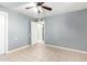 Bedroom featuring a ceiling fan, tile floor, and doorway at 2064 W 2Nd St, Mesa, AZ 85201