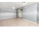 Spacious bedroom featuring tile flooring, closet, neutral gray wall color, and overhead lighting at 2064 W 2Nd St, Mesa, AZ 85201