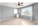 Bedroom featuring a ceiling fan, tile floor, and large windows at 2064 W 2Nd St, Mesa, AZ 85201