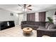 Comfortable living room with tile floors, large sectional, and ceiling fan for relaxed living at 2064 W 2Nd St, Mesa, AZ 85201