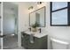 Stylish bathroom featuring a double sink vanity with a modern mirror and sleek fixtures at 2087 N 77Th Pl, Mesa, AZ 85207