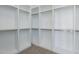 Spacious walk-in closet with ample shelving and storage space, perfect for organization at 2087 N 77Th Pl, Mesa, AZ 85207