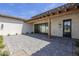Charming courtyard with a brick patio and stone accents, perfect for outdoor entertaining at 2087 N 77Th Pl, Mesa, AZ 85207