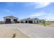 Expansive driveway with attractive pavers offers ample parking space, complementing the home's modern aesthetic at 2087 N 77Th Pl, Mesa, AZ 85207