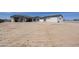 Exterior view of the back of the house with large dirt area awaiting personalization and landscaping at 2087 N 77Th Pl, Mesa, AZ 85207