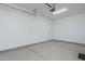 Bright, empty garage shows neutral painted walls and floor; ready for immediate use and storage at 2087 N 77Th Pl, Mesa, AZ 85207