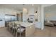 Well-appointed kitchen with white cabinets, stainless steel appliances, and an inviting island for meal preparation and casual dining at 2087 N 77Th Pl, Mesa, AZ 85207