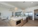 Modern kitchen with stainless steel appliances, a large island, and open layout perfect for entertaining guests at 2087 N 77Th Pl, Mesa, AZ 85207