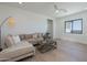 Inviting living room featuring a comfortable sectional sofa and a stylish rustic coffee table at 2087 N 77Th Pl, Mesa, AZ 85207