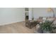 Bright living room with light wood floors, rustic coffee table and an open entryway at 2087 N 77Th Pl, Mesa, AZ 85207