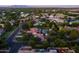 Serene neighborhood aerial view highlighting tile roof homes with backyard pools and a lush tree canopy at 2107 E Park Ave, Gilbert, AZ 85234