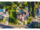 An expansive backyard features a luxurious pool, sprawling greenery, lush landscaping, and serene outdoor space at 2107 E Park Ave, Gilbert, AZ 85234