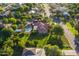 Overhead angle shows the home's landscaping, hardscape, grass and mature trees at 2107 E Park Ave, Gilbert, AZ 85234
