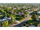 Aerial view captures a home with a pool and spacious backyard, nestled in a lush neighborhood at 2107 E Park Ave, Gilbert, AZ 85234