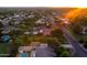 Aerial shot showcases multiple homes with backyard pools and mature trees in a serene residential neighborhood at 2107 E Park Ave, Gilbert, AZ 85234